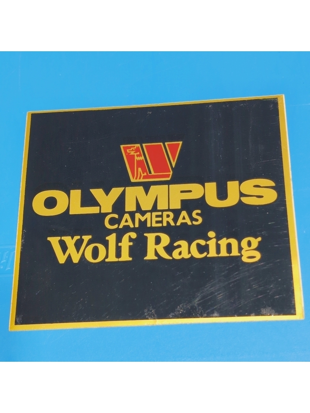 1979 Wolf Racing F-1 WR7 Olympus Cameras Original Decal 5x4.5 In